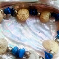 Image 1 of Dyed Blue Mother of Pearl and Button Top Seashell Bracelet