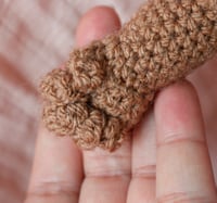 Image 2 of Brown Crochet Baby Doll – Soft Amigurumi Toy with Removable Clothing