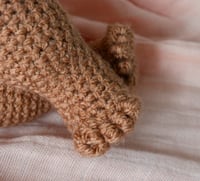 Image 4 of Brown Crochet Baby Doll – Soft Amigurumi Toy with Removable Clothing
