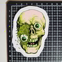 Image 2 of Rotting Skull With Maggots And Eyeball Pouring Out Of Eye Socket Matte Vinyl Sticker