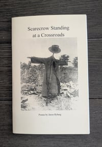 Scarecrow Standing at a Crossroads