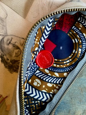 Image of portrait sketch collage pouch