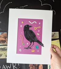 Image 1 of Shiny things cut paper crow