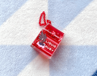 Image 1 of Gravel's Liquid Ruby Carton Keychain