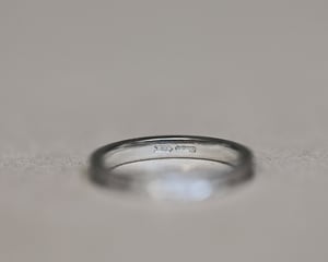 Image of Platinum 2mm flat court ‘Olive leaf’ and milled edge engraved ring