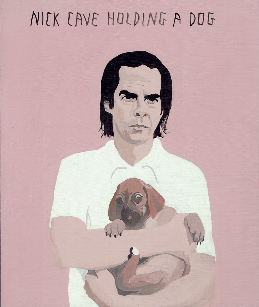 Image of NICK CAVE HOLDING A DOG