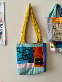 Image 3 of tote with orange flower flap