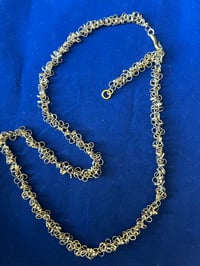 Image 1 of Gold necklace with tiny clusters of gold rings