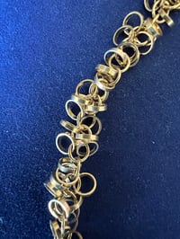 Image 4 of Gold necklace with tiny clusters of gold rings