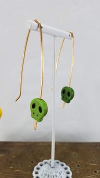 Image 3 of Smash it Pretty Festive Skull Silhouette Red or Yellow Elf Ear Long Bronze Earrings f...