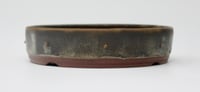 Image 2 of Round studded  bonsai pot in a copper glaze. D.150mm