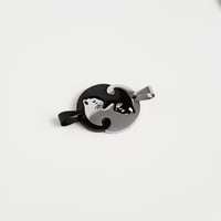 Image 1 of interlocking cat pendants