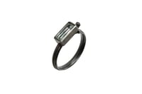 Image 1 of modern oxidised silver ring set with a crisp baguette-cut aquamarine in a clean, architectural desig