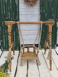Image 1 of Wooden props swing 9-24 