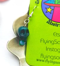 Image 4 of Green and Blue Mismatched Howlite and Glass Skull Earrings