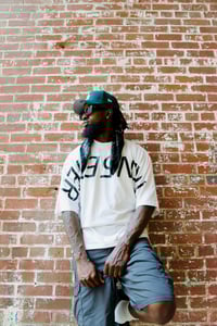 Image 1 of White “Who is Tren5etter” oversized tee