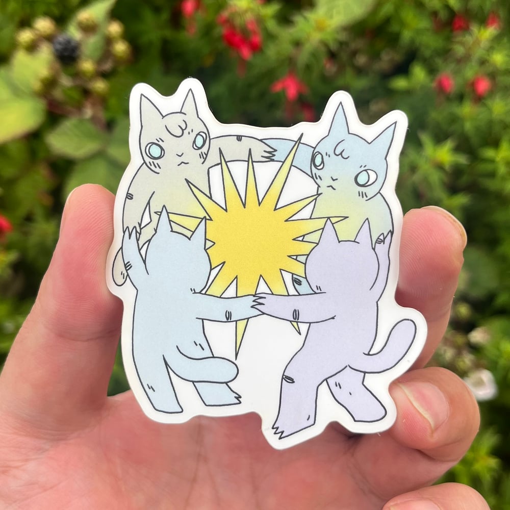 Image of Cats Dancing Around Star in Bed Sticker