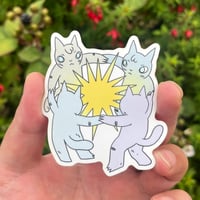 Cats Dancing Around Star in Bed Sticker