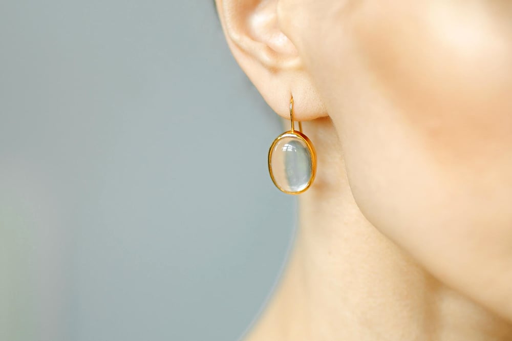 Image of "Rays of sun are striking.." gold plated silver earrings with rock crystals · RADII SE INTER.. ·
