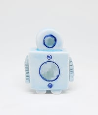 Image 1 of a robot who knows the truth is out there