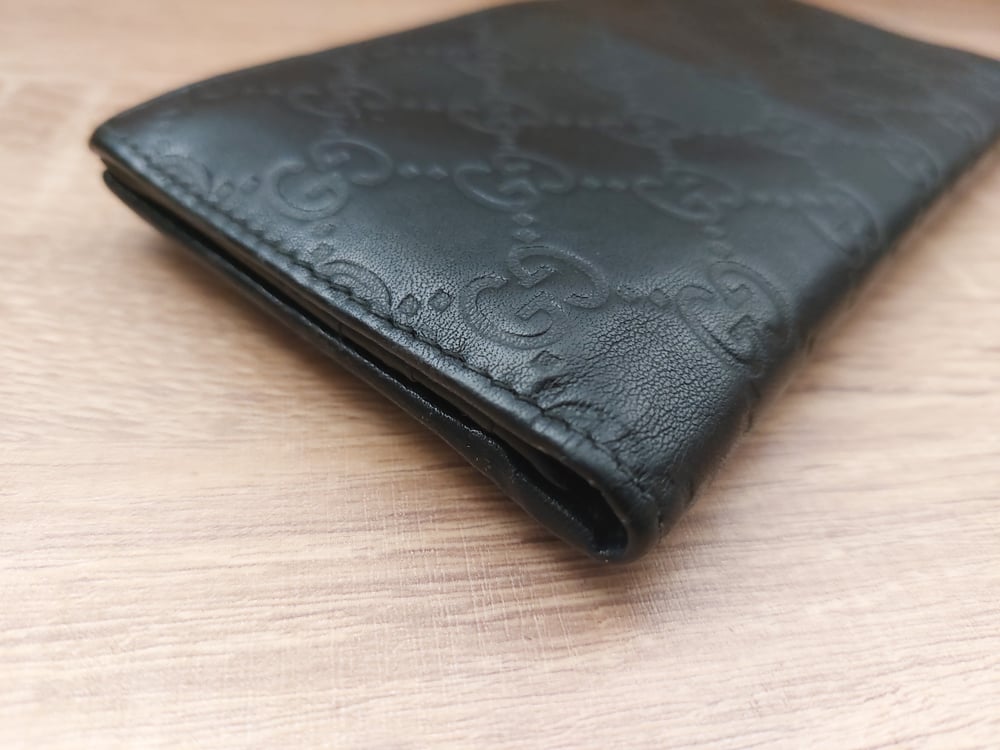 Image of Gucci black leather GG monogram wallet