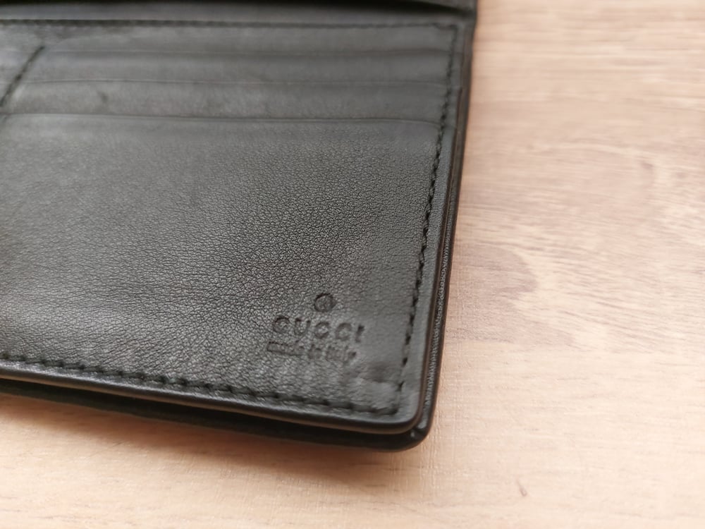 Image of Gucci black leather GG monogram wallet