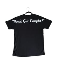 Image 2 of “ Don’t get caught” T-shirt
