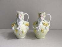 Image 1 of Pair of Antique Miniature Jug Ornaments, Baby Figurines and Leaf Decor, H 8.3cm, small chips/wear 