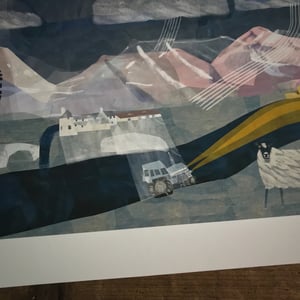 Image of A Tractor is driving past the Sligachan Hotel at night