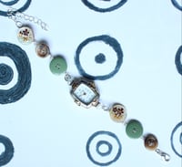 Image 1 of green button watch