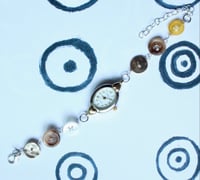 Image 1 of yellow button watch