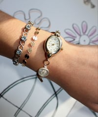 Image 2 of yellow button watch