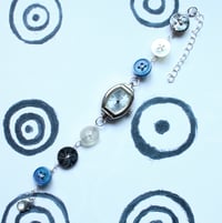 Image 1 of blue button watch