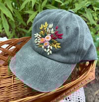 Image 3 of Pink and purple hand embroidered flowers on an adjustable grey hat
