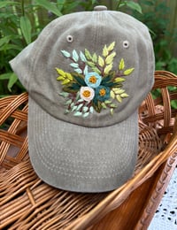 Image 2 of Blue hand embroidered flowers on an adjustable khaki colour hat