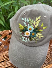 Image 3 of Blue hand embroidered flowers on an adjustable khaki colour hat