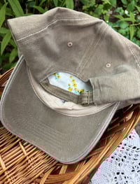 Image 4 of Blue hand embroidered flowers on an adjustable khaki colour hat