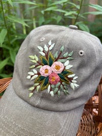 Image 2 of Dark and light pink hand embroidered flowers on an adjustable khaki colour hat