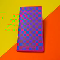 Image 1 of Pink with blue checks slim notebook.