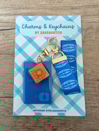Image 6 of Severance Wristlet and Charm Keychain Set - Lumon Waffle Party
