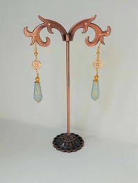 Image 5 of Art deco gold floral cut out earrings handmade with sky blue & gold splash Czech glass drops