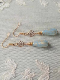 Image 4 of Art deco gold floral cut out earrings handmade with sky blue & gold splash Czech glass drops