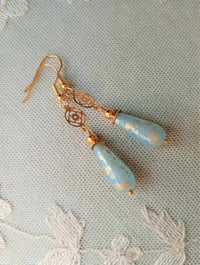 Image 8 of Art deco gold floral cut out earrings handmade with sky blue & gold splash Czech glass drops