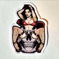 Image 1 of Beautiful Devil Woman With Legs Protruding From The Orbits Of A Skull Glossy Finish Vinyl Sticker