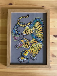 Image 2 of Tiger snake fight dark background