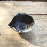 Image 1 of 27. Pourer