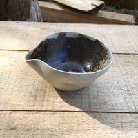 Image 4 of 27. Pourer