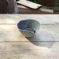 Image 5 of 27. Pourer