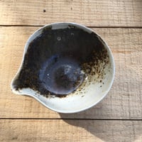 Image 2 of 27. Pourer