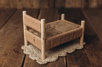 Image 5 of A wooden bed wrapped with thick rope